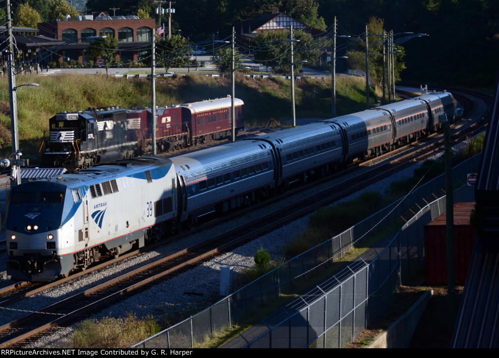 Northward goes Amtrak train 66 passing by the NS research train.